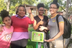 Hermitage Street garden displays their CEGA award sign.